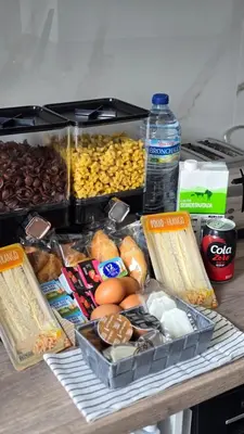 a table with a bunch of different types of food at Arena Legacy Modern Suits in Valencia