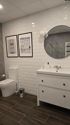 a bathroom with a sink and a toilet and a mirror at Arena Legacy Modern Suits in Valencia