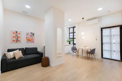 a living room with a couch and a table at Apartments LEON PARE RICO in Valencia