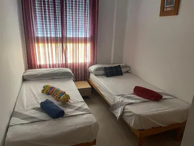 a room with a door to a bathroom with a toilet at Acogedor piso en Benissanó in Benisanó