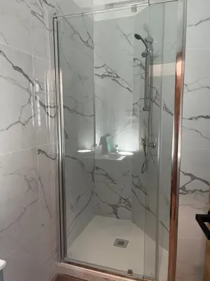 a shower with a glass door in a bathroom at STAR Plaza España in Valencia