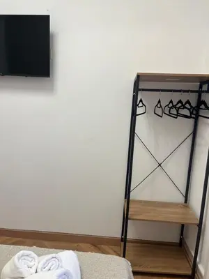 a room with a towel rack and a tv at STAR Plaza España in Valencia