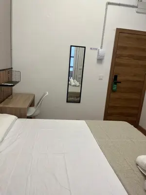 a bedroom with a white bed and a mirror at STAR Plaza España in Valencia