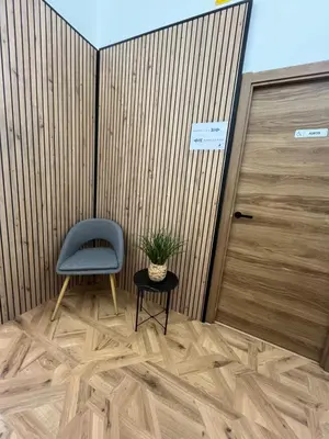 a room with a blue chair and a table and a door at STAR Plaza España in Valencia