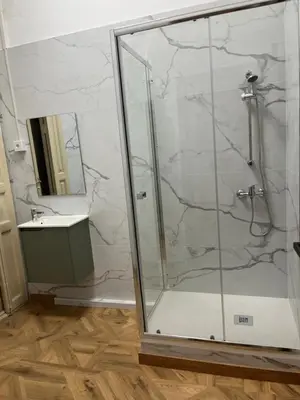 a shower stall in a bathroom with a sink at STAR Plaza España in Valencia