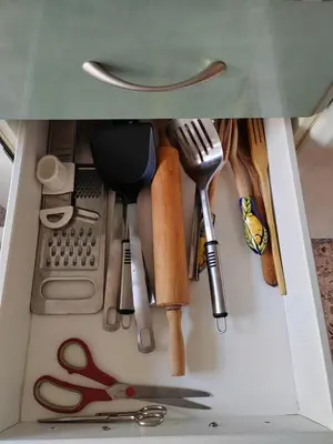 a drawer filled with lots of kitchen utensils at Au bord de la plage in Puerto de Sagunto