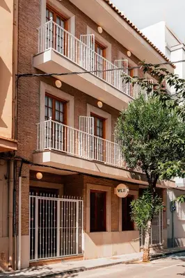 a building with balconies on the side of it at Valencia Living Suites in Picanya