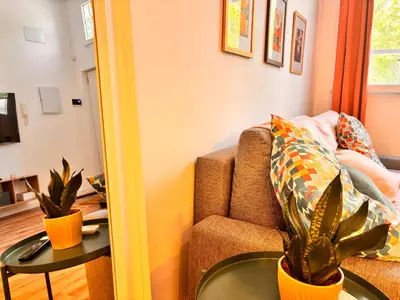 a living room with a couch and a table at Loft Llum Valencia in Valencia