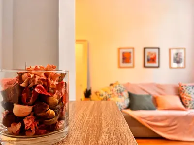 a vase filled with shells on a table in a living room at Loft Llum Valencia in Valencia