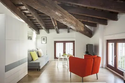 a living room with a couch and a chair at SingularStays San Vicente in Valencia