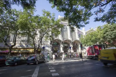 a building with cars parked in front of a street at SingularStays San Vicente in Valencia