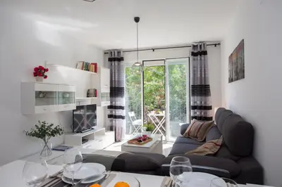 a living room with a couch and a table at SingularStays Na Jordana in Valencia