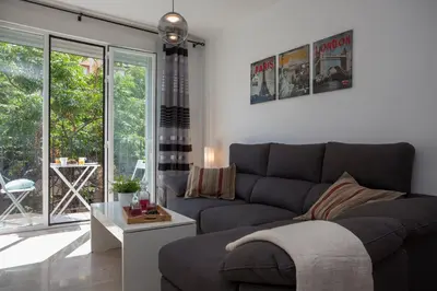 a living room with a couch and a table at SingularStays Na Jordana in Valencia