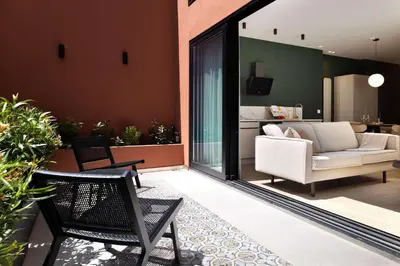 a living room with a couch and a chair at SariStays Valencia Modern & O in Valencia