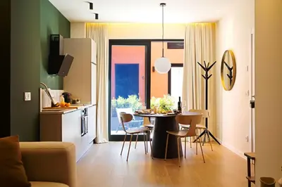 a kitchen and a dining room with a table and chairs at SariStays Valencia Modern & O in Valencia