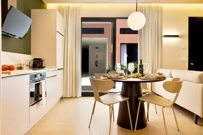 a kitchen and dining room with a table and chairs at SariStays Valencia Modern & O in Valencia