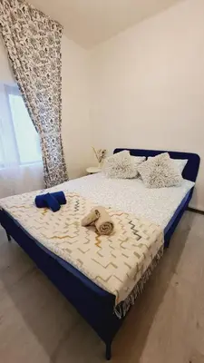a bedroom with a bed with two slippers on it at 3 bedroom apartment with a terrace 50 steps from the Nules beach in Mascarell