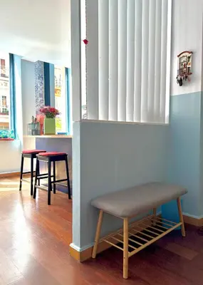 a room with two tables and a bench at Trendy Ruzafa Neighborhood - Spacious Luxury 3BR with Double Terrace in Valencia
