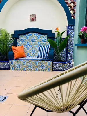 a bench with colorful pillows on a patio at Trendy Ruzafa Neighborhood - Spacious Luxury 3BR with Double Terrace in Valencia
