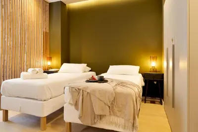 a hotel room with two beds with white sheets at SariStays Valencia Finca Verde L in Valencia