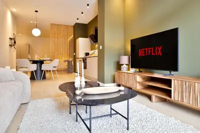a living room with a flat screen tv on a entertainment center at SariStays Valencia Finca Verde R in Valencia