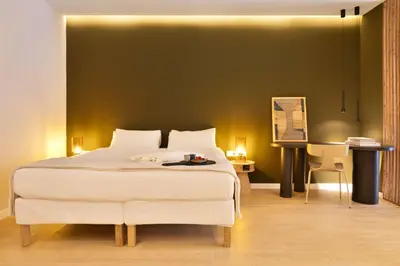 a bedroom with a large white bed and a desk at SariStays Valencia Finca Verde R in Valencia