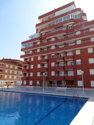 a large swimming pool in front of a building at LAS LANZAS II - ATF Turisferr in Tavernes de Valldigna