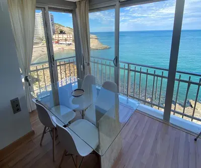 a dining room with a view of the ocean at Fantásticas vistas al mar en el Faro in Faro de Cullera
