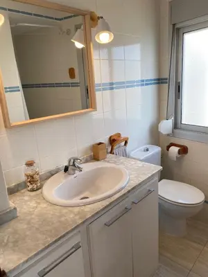 a bathroom with a sink and a toilet at Fantásticas vistas al mar en el Faro in Faro de Cullera