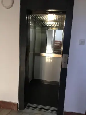 a glass door leading into a room with a shelf at Fantásticas vistas al mar en el Faro in Faro de Cullera