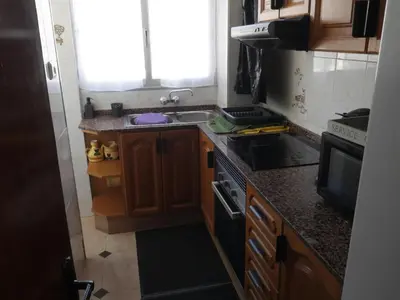 a kitchen with a sink and a stove top oven at El Raco, C-5-10 in Cullera