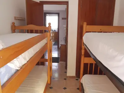 a room with two bunk beds and a hallway at El Raco, C-5-10 in Cullera