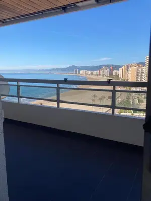 a balcony with a view of the ocean on a building at Résidence El Prado in Cullera