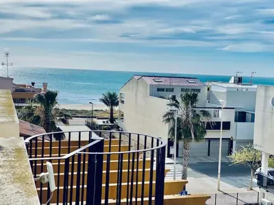 a view of the ocean from a balcony of a building at Puzol beach penthouse in Playa de Mar