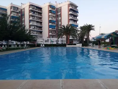 a large swimming pool in front of some buildings at ESPECIAL FALLAS 25 MINUTOS VALENCIA PLAYA in Puerto de Sagunto