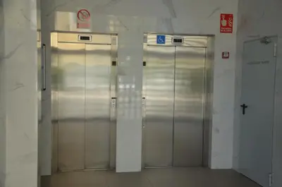 two metal elevator doors in a subway station at Fabuloso Piso Playa Canet de Bereguer Alquiler minimo 11 noches llamar al 64039uno856 in Canet de Berenguer