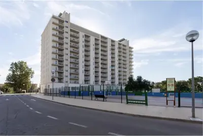 a large white building on the side of a street at Fabuloso Piso Playa Canet de Bereguer Alquiler minimo 11 noches llamar al 64039uno856 in Canet de Berenguer