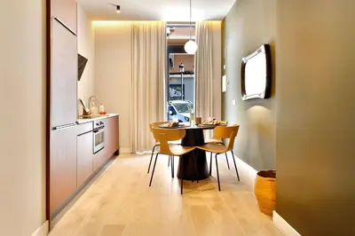 a kitchen and dining room with a table and chairs at SariStays Valencia City Center L in Valencia