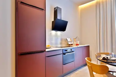 a kitchen with a large refrigerator and a table at SariStays Valencia City Center L in Valencia