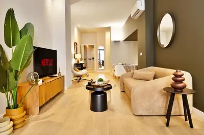 a living room with a couch and a tv at SariStays Valencia City Center R in Valencia