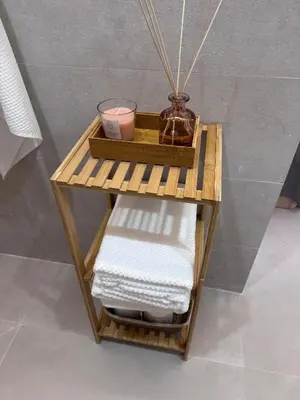 a bamboo shelf with towels on it in a bathroom at Apartamento Boutique Valencia 4-Pax - A-1 in Valencia