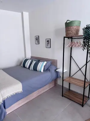 a bedroom with a bed and a shelf at Apartamento Boutique Valencia 4-Pax - B-2 in Valencia