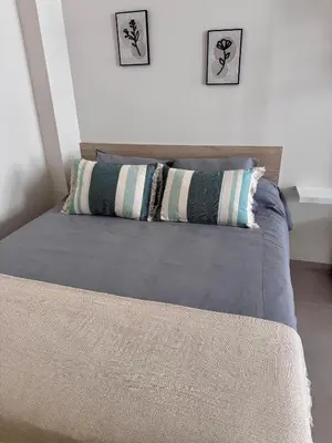a bedroom with a bed with two pillows on it at Apartamento Boutique Valencia 4-Pax - B-2 in Valencia