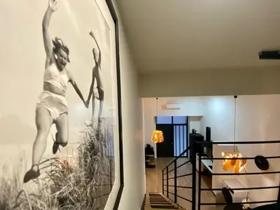 a hallway with a wall mural of two girls jumping at Duplex City of Arts & Science in Valencia