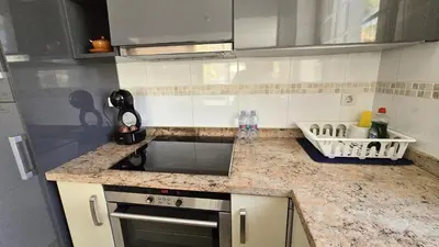 a kitchen with a sink and a counter top at BEACH VALENCIA LUXURY A36-22 Apartment with terrace and sea views in Valencia
