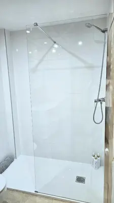 a shower with a glass door in a bathroom at BEACH VALENCIA LUXURY A36-22 Apartment with terrace and sea views in Valencia
