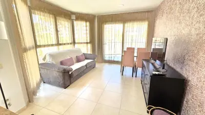 a living room with a couch and a table at BEACH VALENCIA LUXURY A36-22 Apartment with terrace and sea views in Valencia