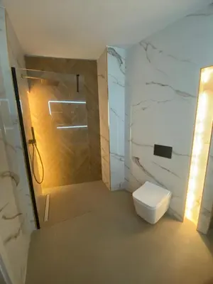 a bathroom with a white toilet and a shower at Room Turia in Valencia