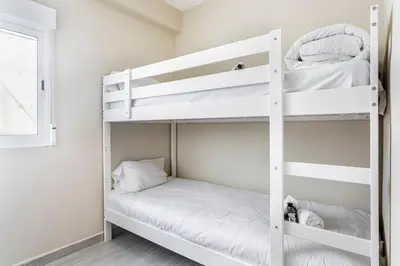 a bedroom with a white bed and a window at GuestReady - Your Relaxing Base in Valencia in Valencia