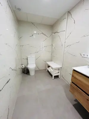 a bathroom with a toilet and a sink at Aires de Valencia in Valencia